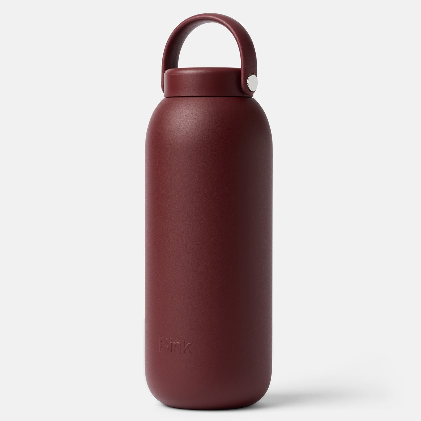 Red water bottle with a cap on a white background