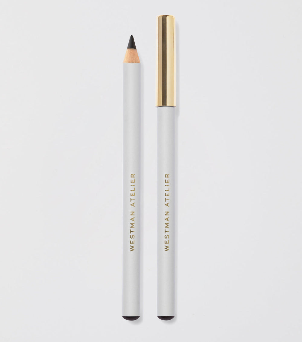 Eyebrow pencil with gold cap and white body on light gray background