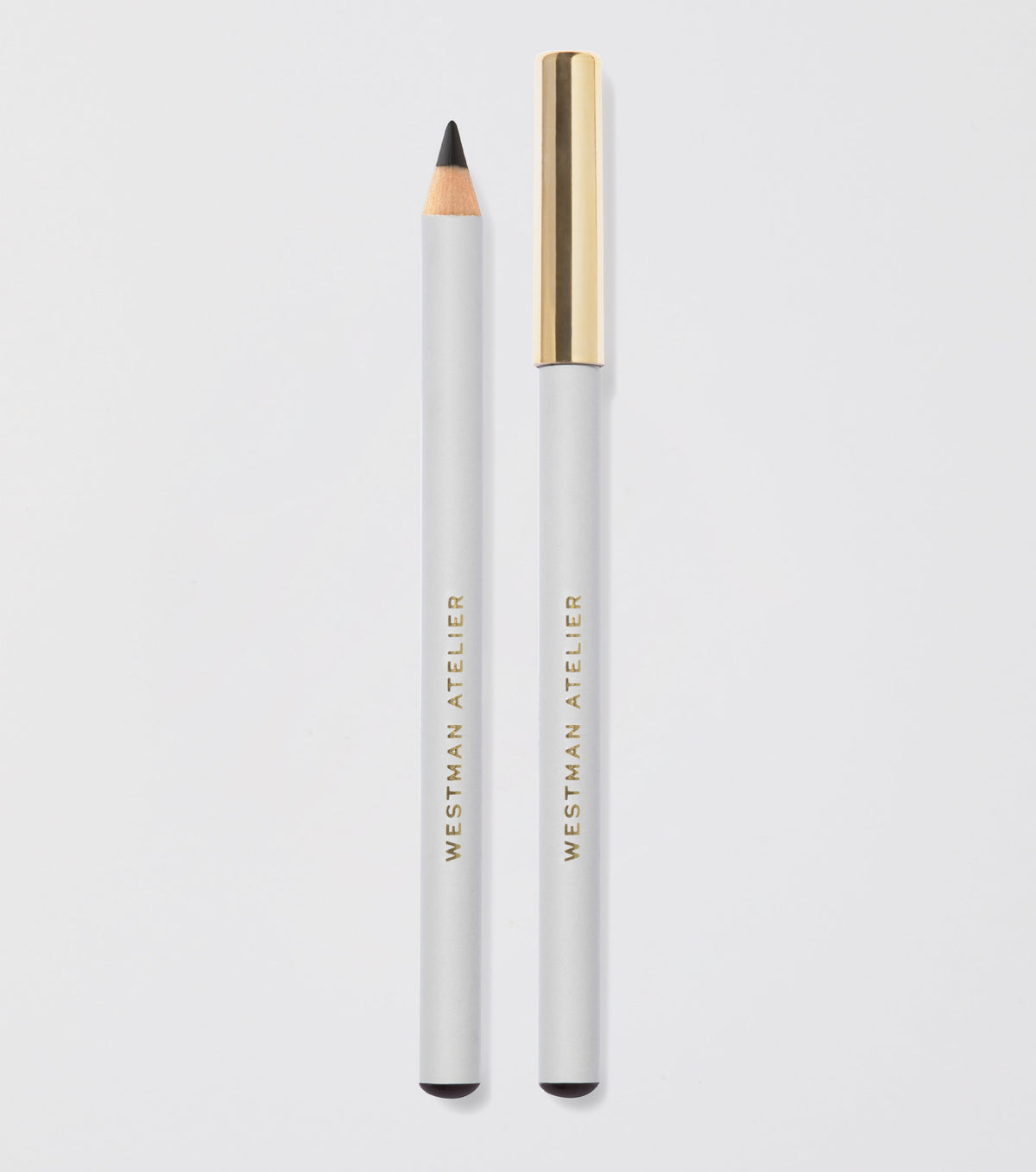 Eyebrow pencil with gold cap and white body on light gray background
