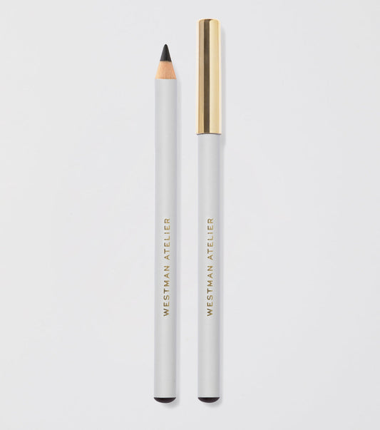 Eyebrow pencil with gold cap and white body on light gray background