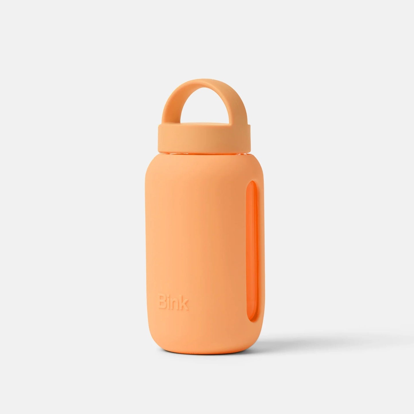 Orange water bottle with a lid on a light gray background