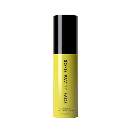 A single bottle of Sofie Pavitt Face Mandelic Clearing Serum, featuring a bright yellow body and a black cap, centered on a plain white background.